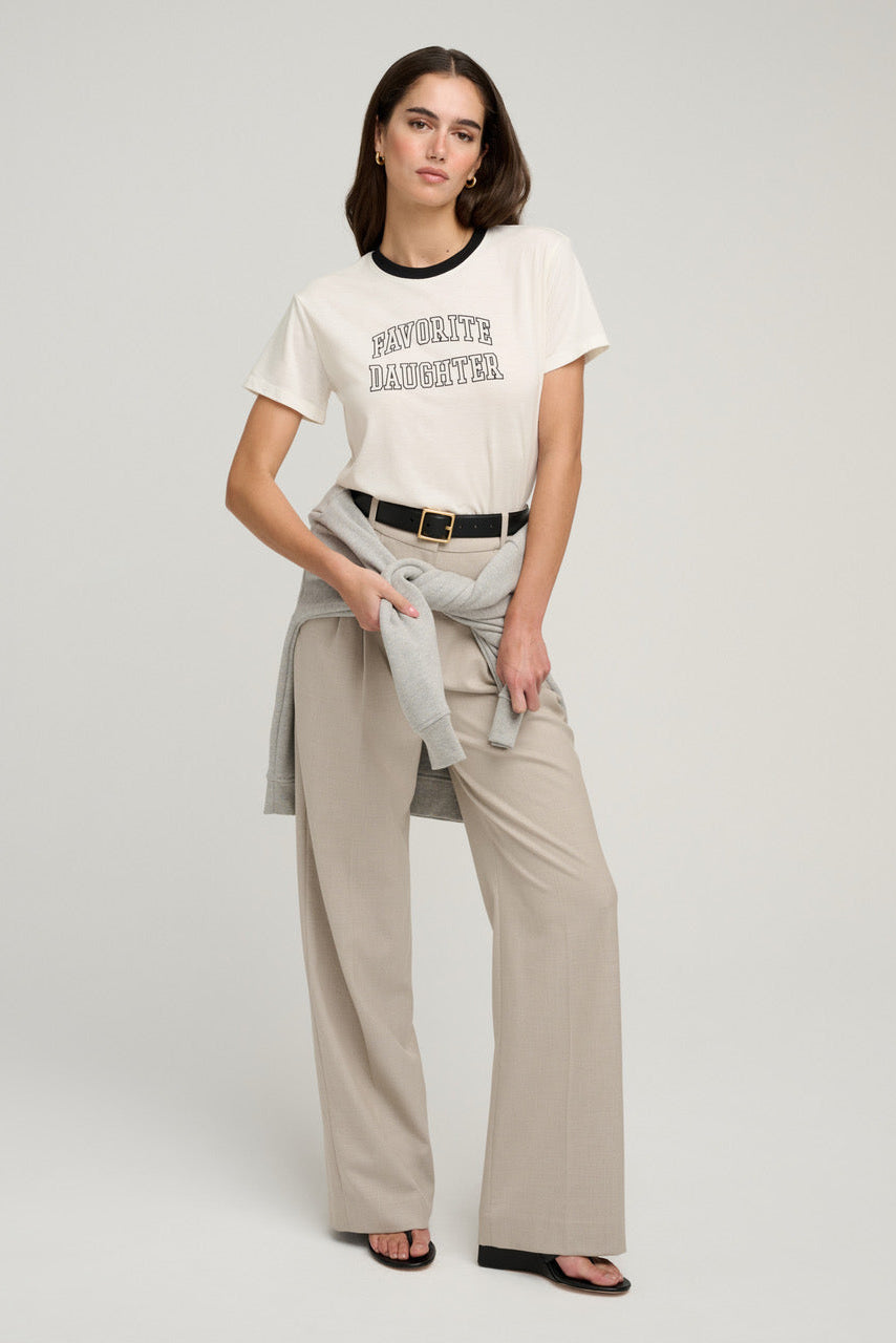 Woman wearing a white t-shirt with text 
