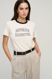 Woman wearing a white t-shirt with 'FAVORITE DAUGHTER' text