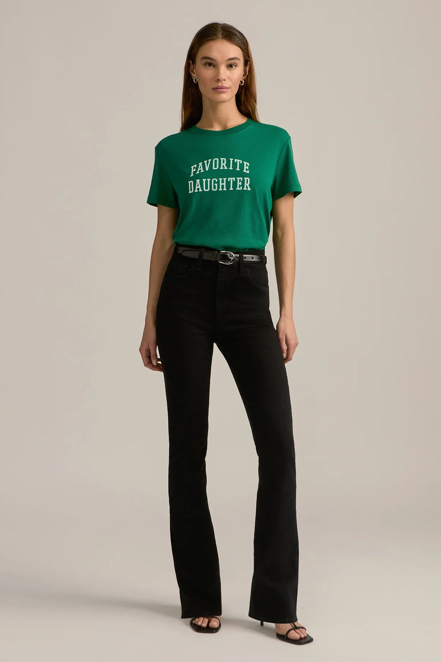 woman wearing an emerald green graphic cropped tee reading "FAVORITE DAUGHTER"