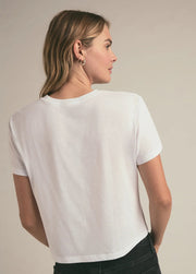 Woman wearing a graphic cropped tee that reads "FAVORITE DAUGHTER" on the front