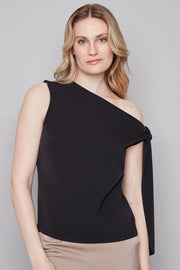 woman wearing a black off the shoulder bow top 