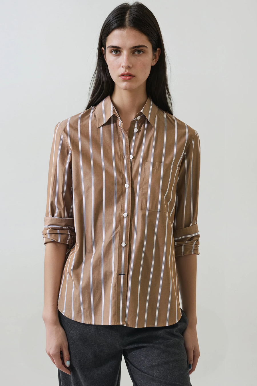 model wearing light brown with white stripes button up collard long sleeve 