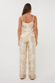 A  V-neck top with adjustable spaghetti straps in a Safari Print
