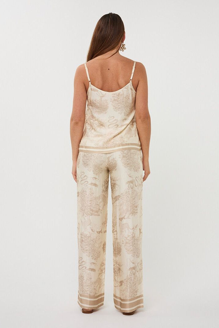 A  V-neck top with adjustable spaghetti straps in a Safari Print