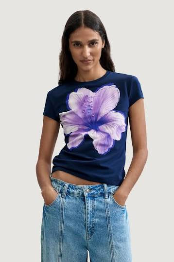 woman wearing navy shirt with purple flower design 
