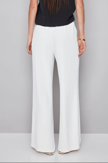 woman wearing a white pant with white shash belt 