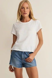 Woman wearing a white crewneck short-sleeve T-shirt, front