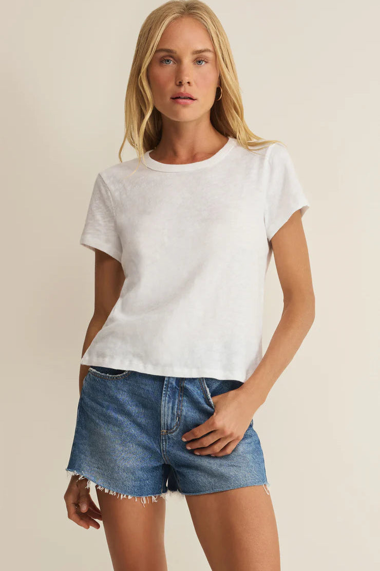 Woman wearing a white crewneck short-sleeve T-shirt, front