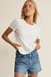 Woman wearing a white crewneck short-sleeve T-shirt, front