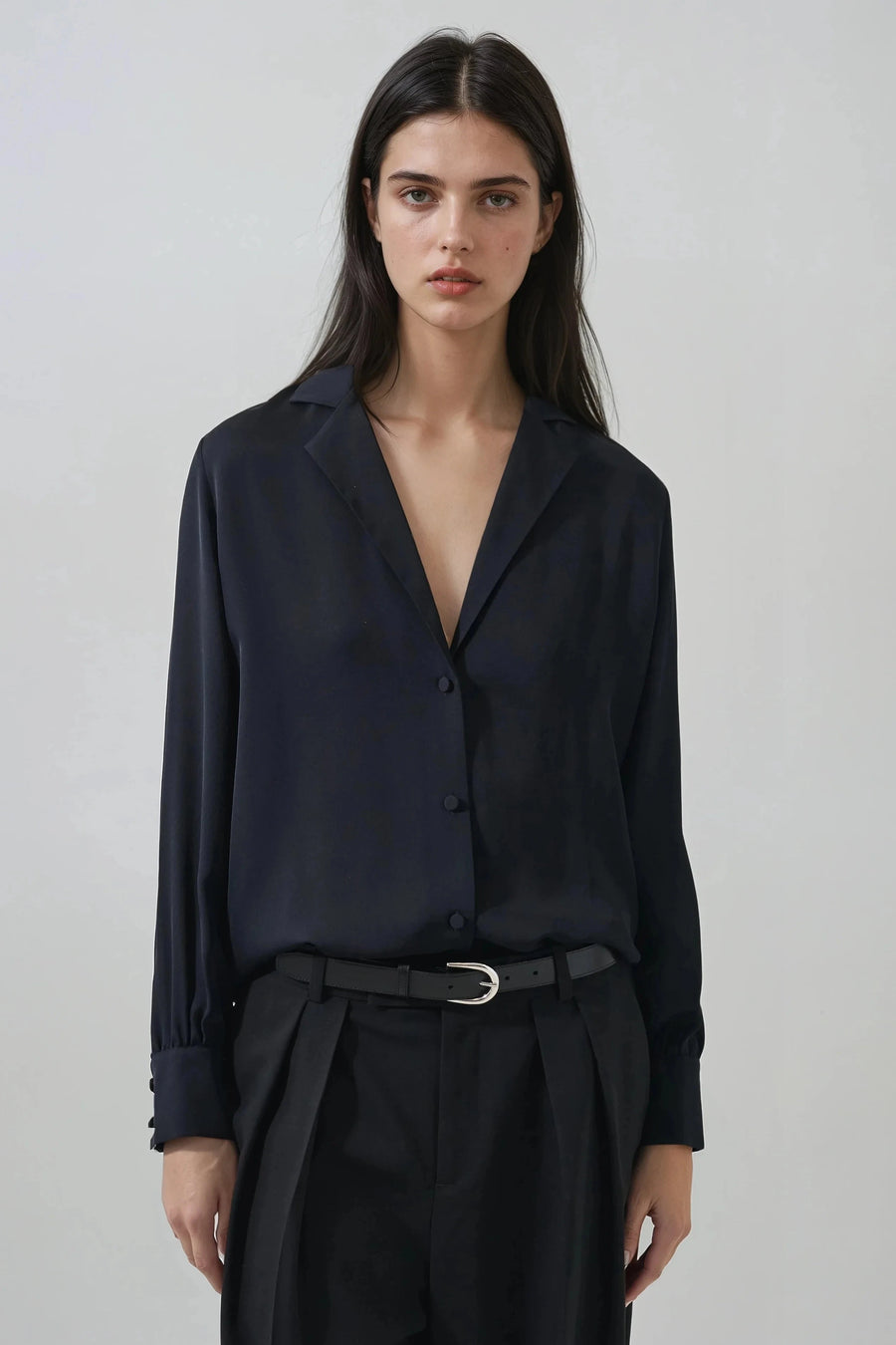 woman wearing black button up v neck blouse 
