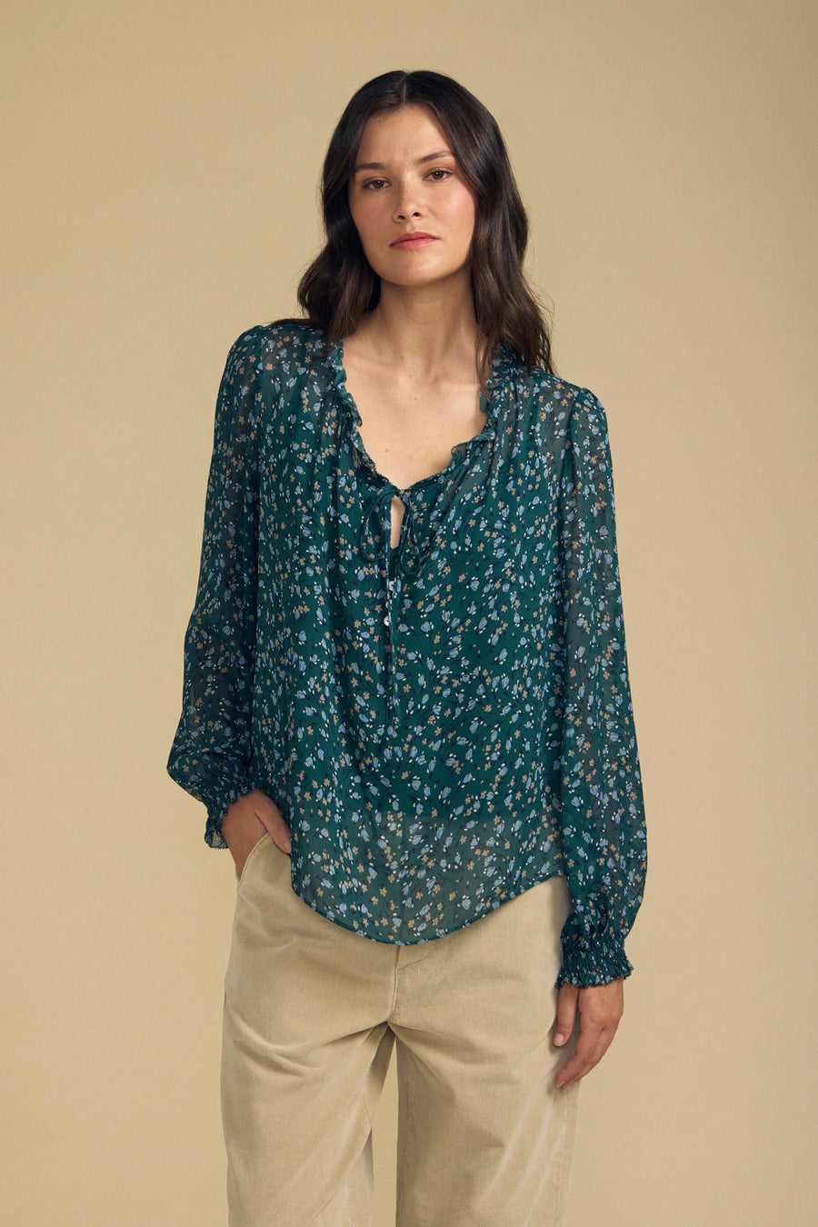 women wearing a dark blue floral blouse 