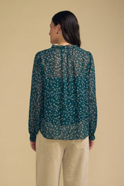women wearing a dark blue floral blouse