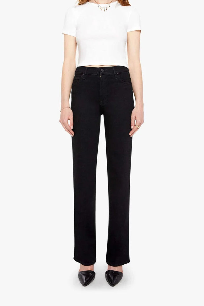 A model wearing black wide-leg jeans, a white cropped short-sleeve top, and black pointed-toe heels against a plain white studio background.