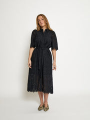 Short-sleeve black dress with a relaxed fit, featuring a soft drape and an easy, flattering silhouette, front
