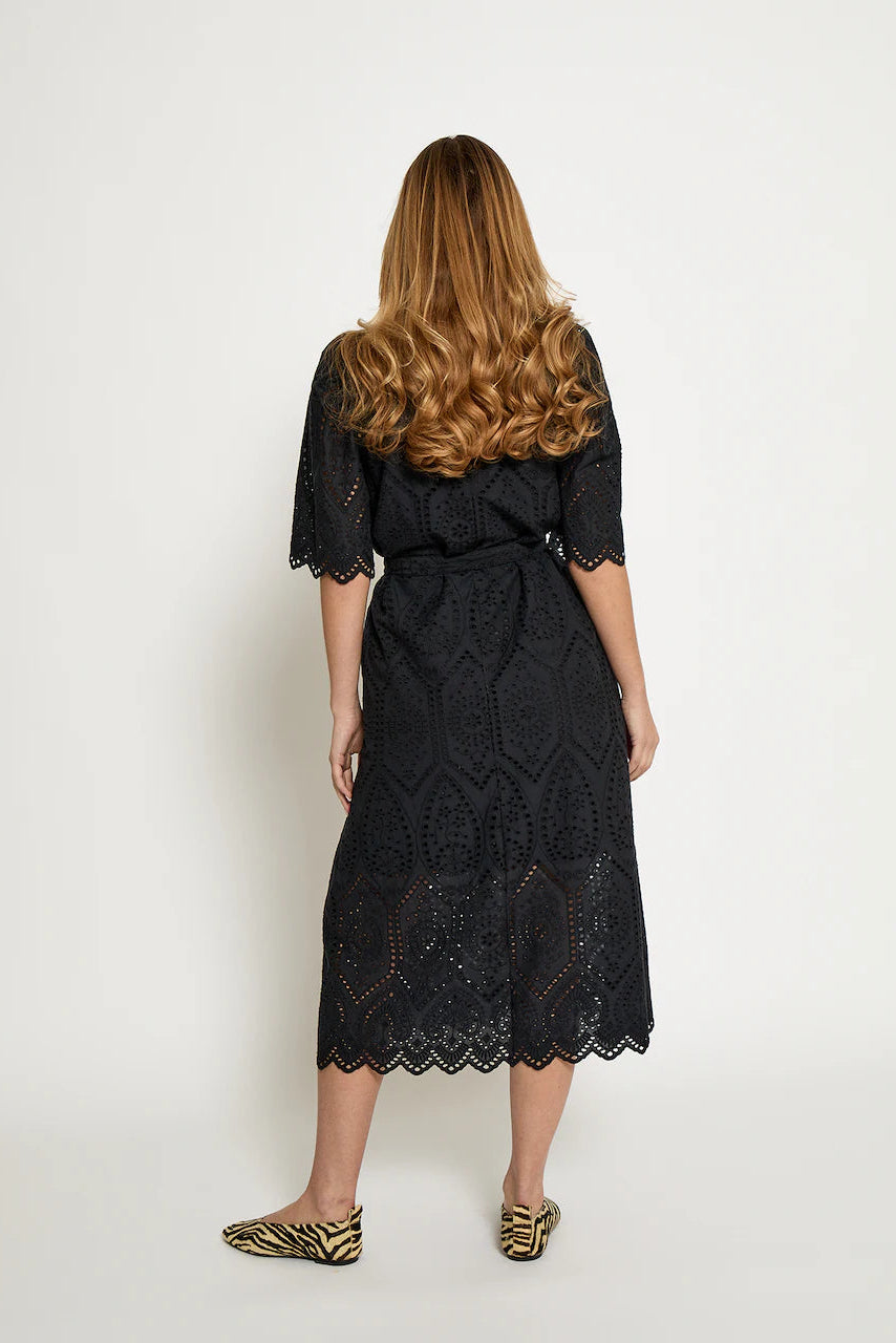 Short-sleeve black dress with a relaxed fit, featuring a soft drape and an easy, flattering silhouette, back
