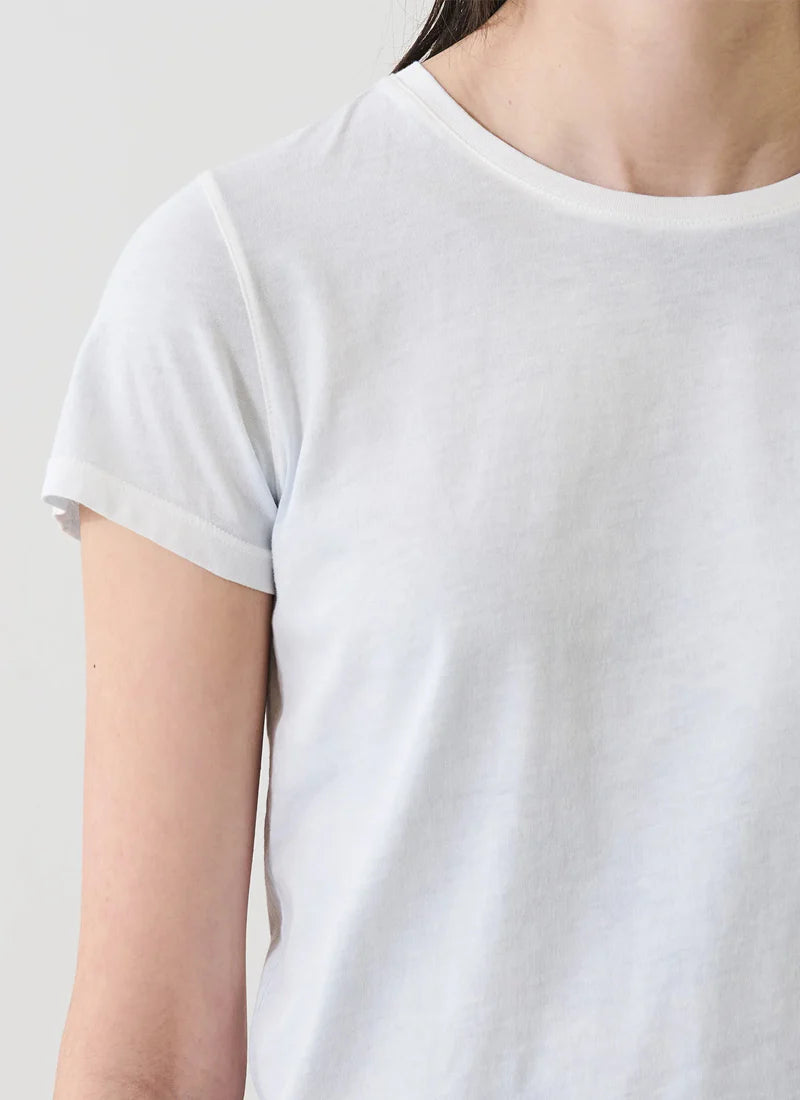 close up of woman wearing a slight blue tee shirt
