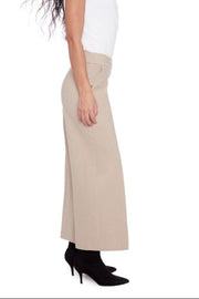 Beige wide-leg pants worn by a person on a white background