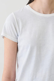Woman wearing a light blue short-sleeve crewneck T-shirt, detail view