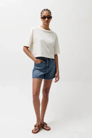 woman wearing a a line denim shorts