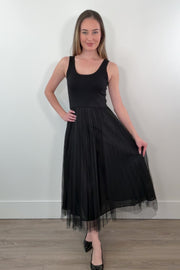 video of a woman waring black sleeveless dress with a tulle skirt