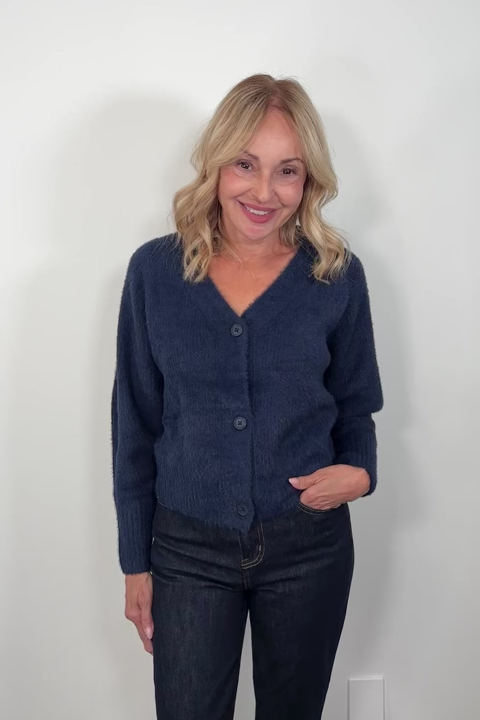 video odds woman wearing a blue cardigan