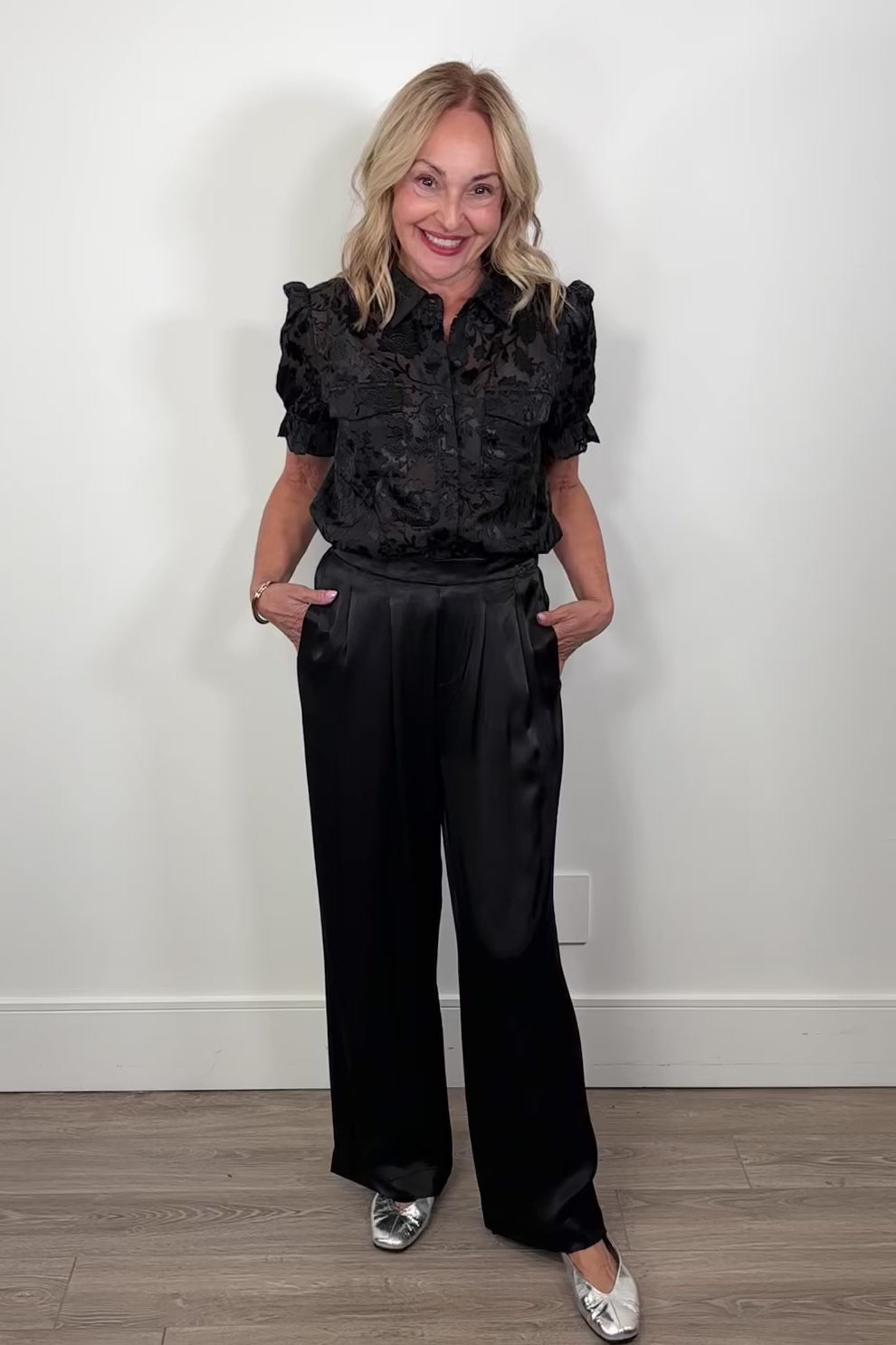 video of a woman wearing black satin pants