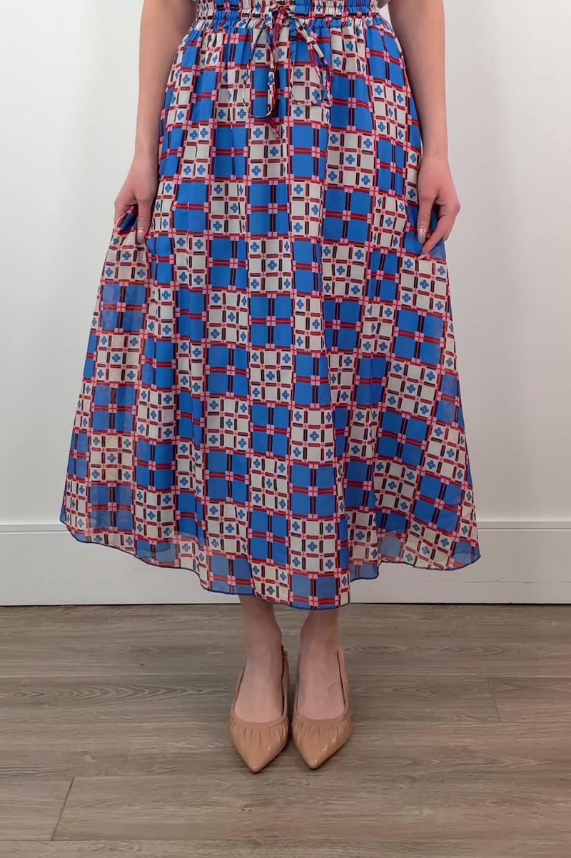 video of a woman wearing an azulejos patterned midi skirt 