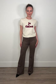 Video of woman wearing a houndstooth knit pant