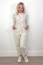 Video of a woman wearing an oat-coloured corduroy pants