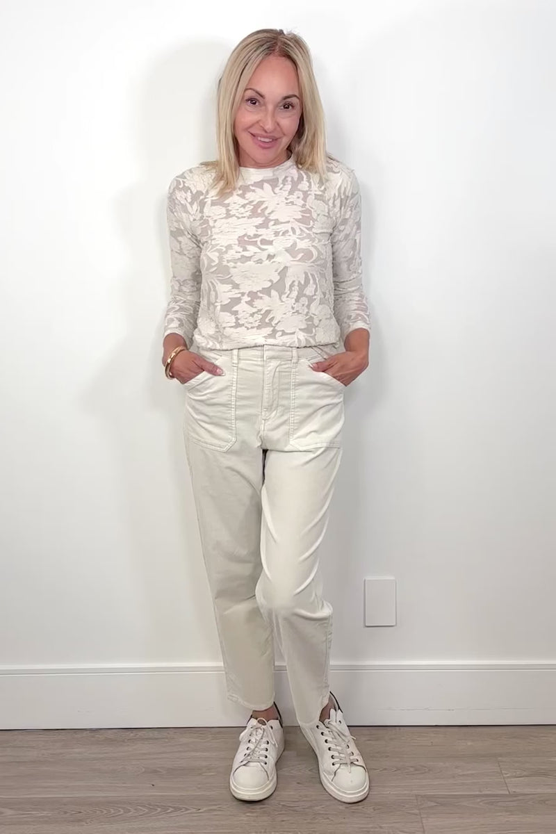 Video of a woman wearing an oat-coloured corduroy pants