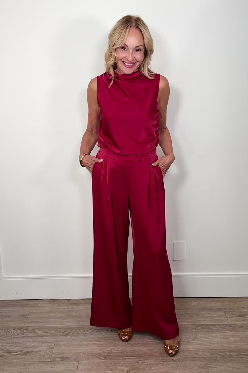 Video of woman wearing a satin red pant