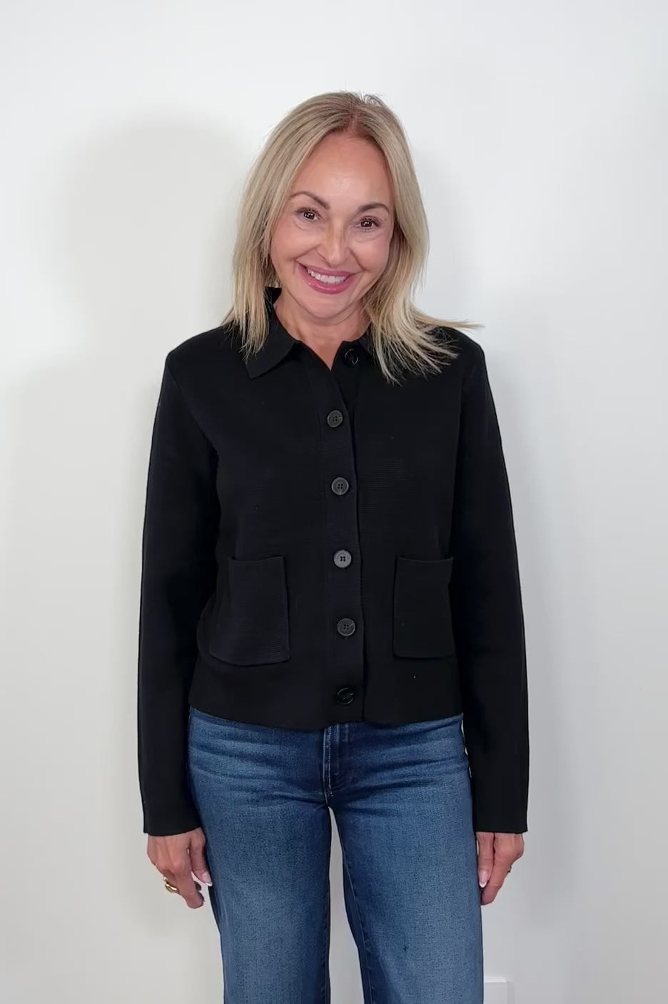 video of woman wearing a black cardigan 