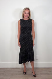 Video of a woman wearing an asymmetrical polka dot midi dress