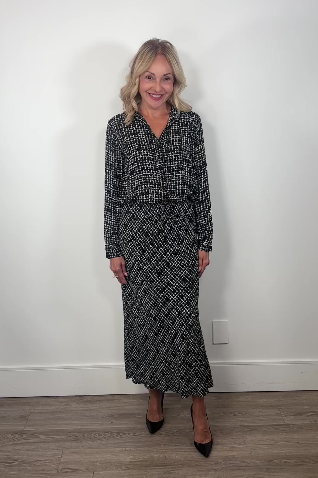 video of a woman wearing a printed maxi skirt