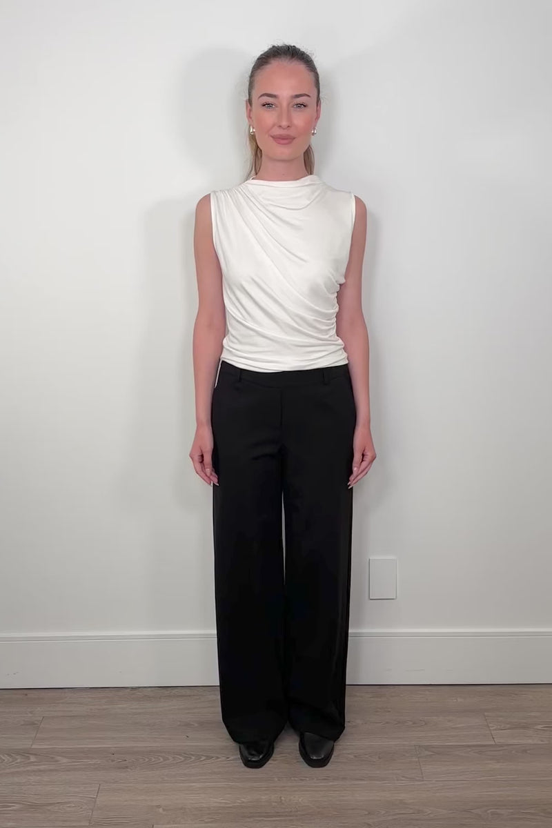 Video of woman wearing a black wide leg ponte pant