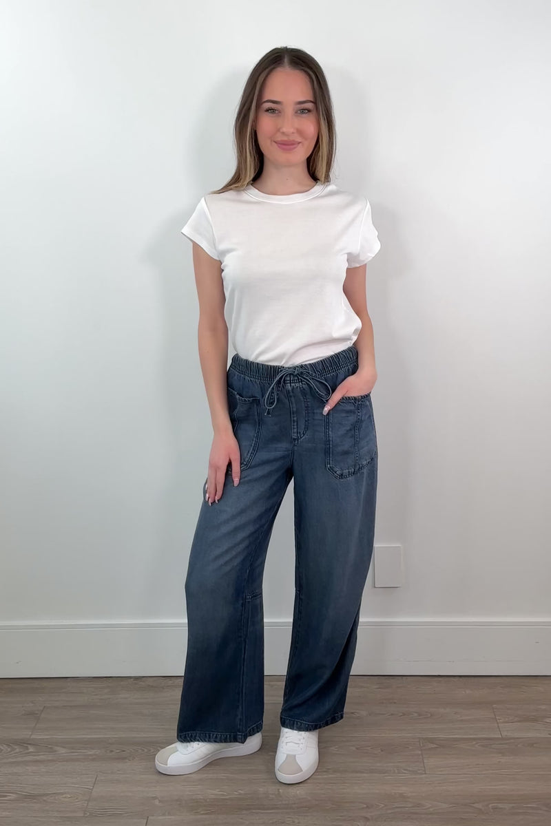 video of a woman wearing an ankle length blue tencel denim wide leg pants