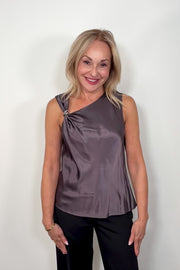 Video of woman wearing a deep metallic gray satin tank top with a silver metal detail