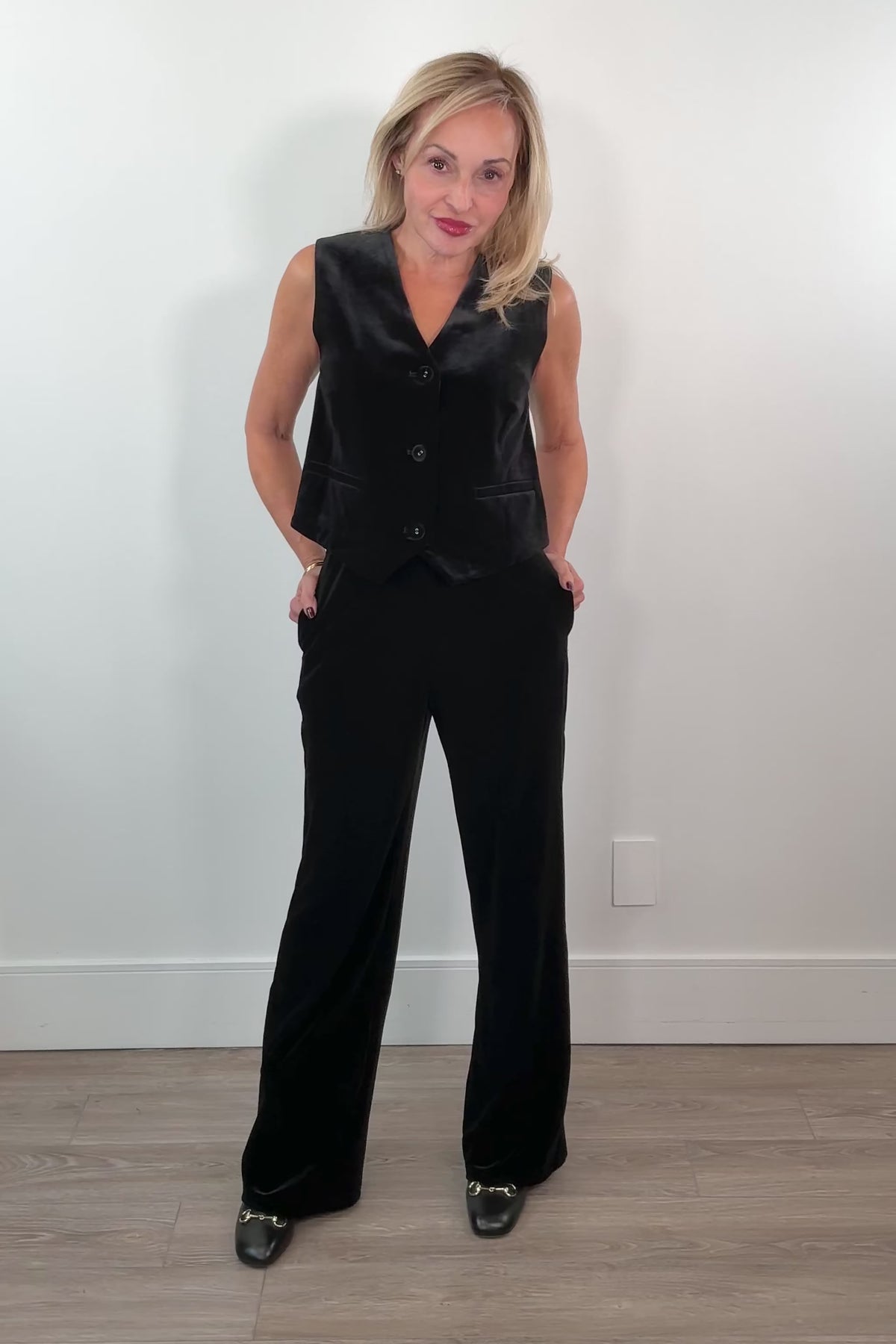 video of a woman wearing black velvet pants