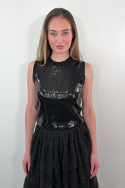 video of a woman wearing a black sequin tank top