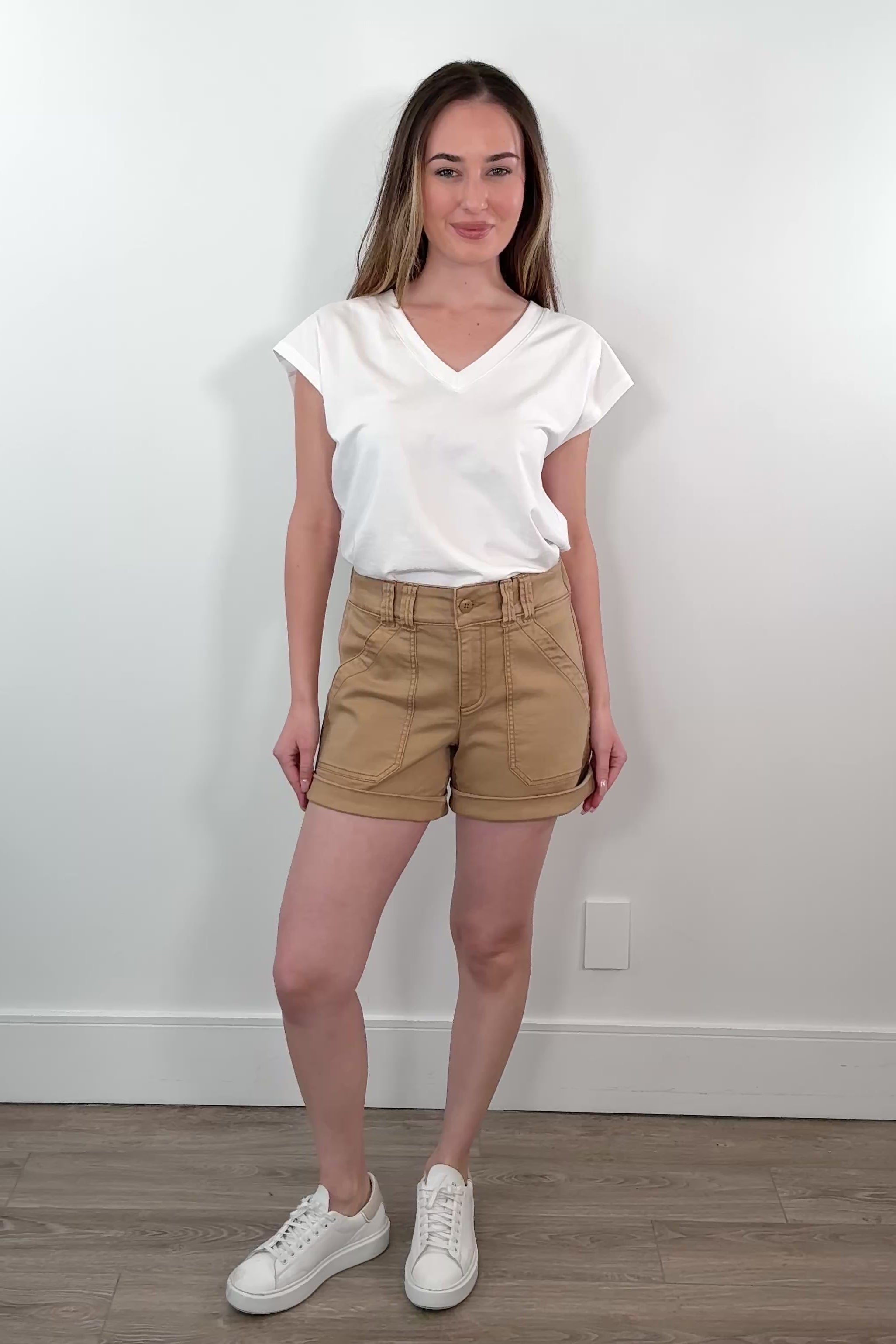 Video of woman wearing rigid shorts in washed beige 