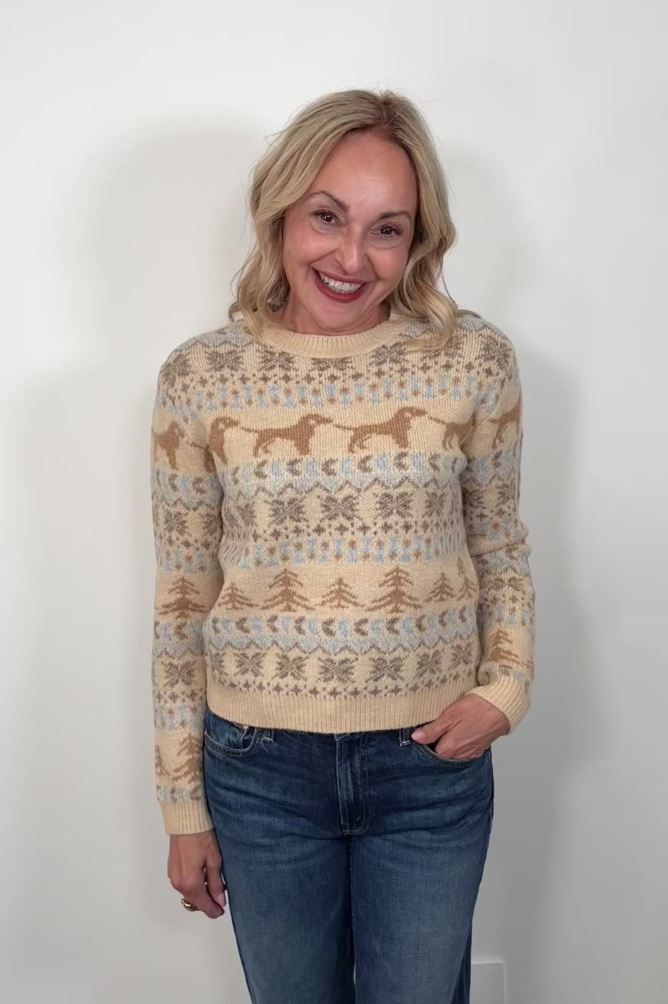 Video of a woman wearing a fun patterned sweater