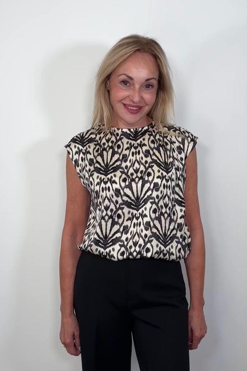 Video of woman wearing a printed Satin sleeveless top