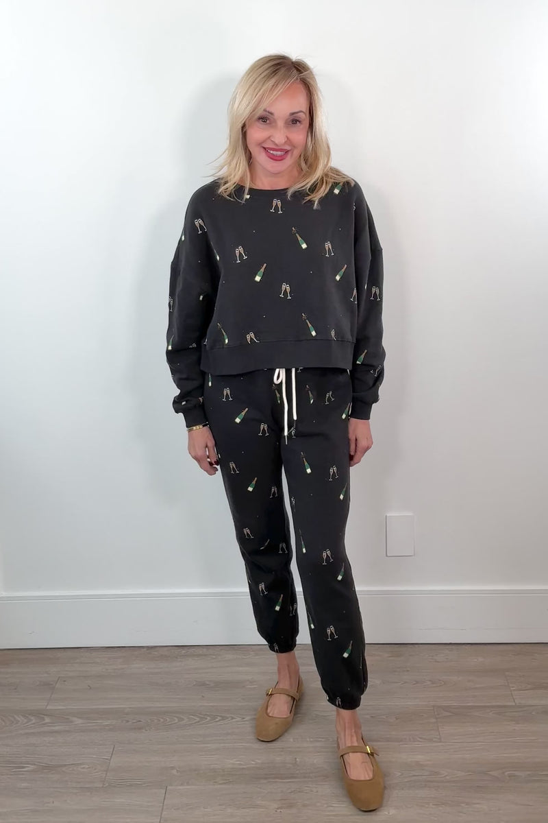 video of a woman wearing black pants with studded side panels