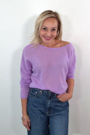 video of a woman wearing a cashmere lilac oversized reversible sweater