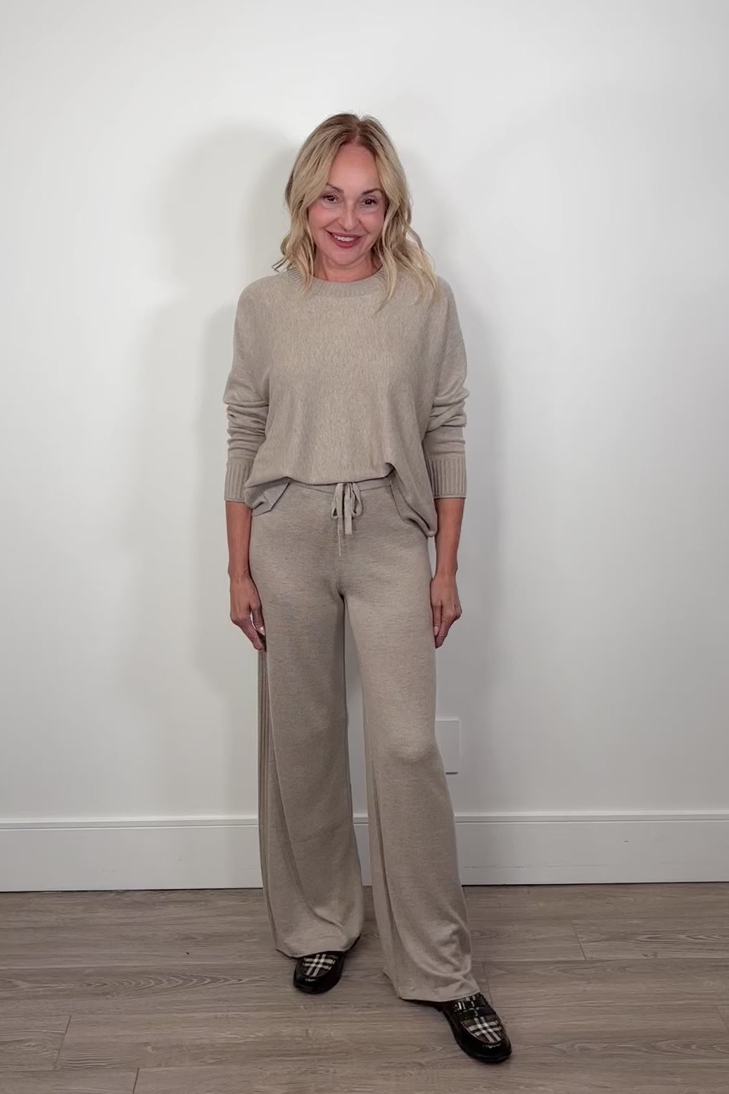 Video of a woman wearing a light rib pant
