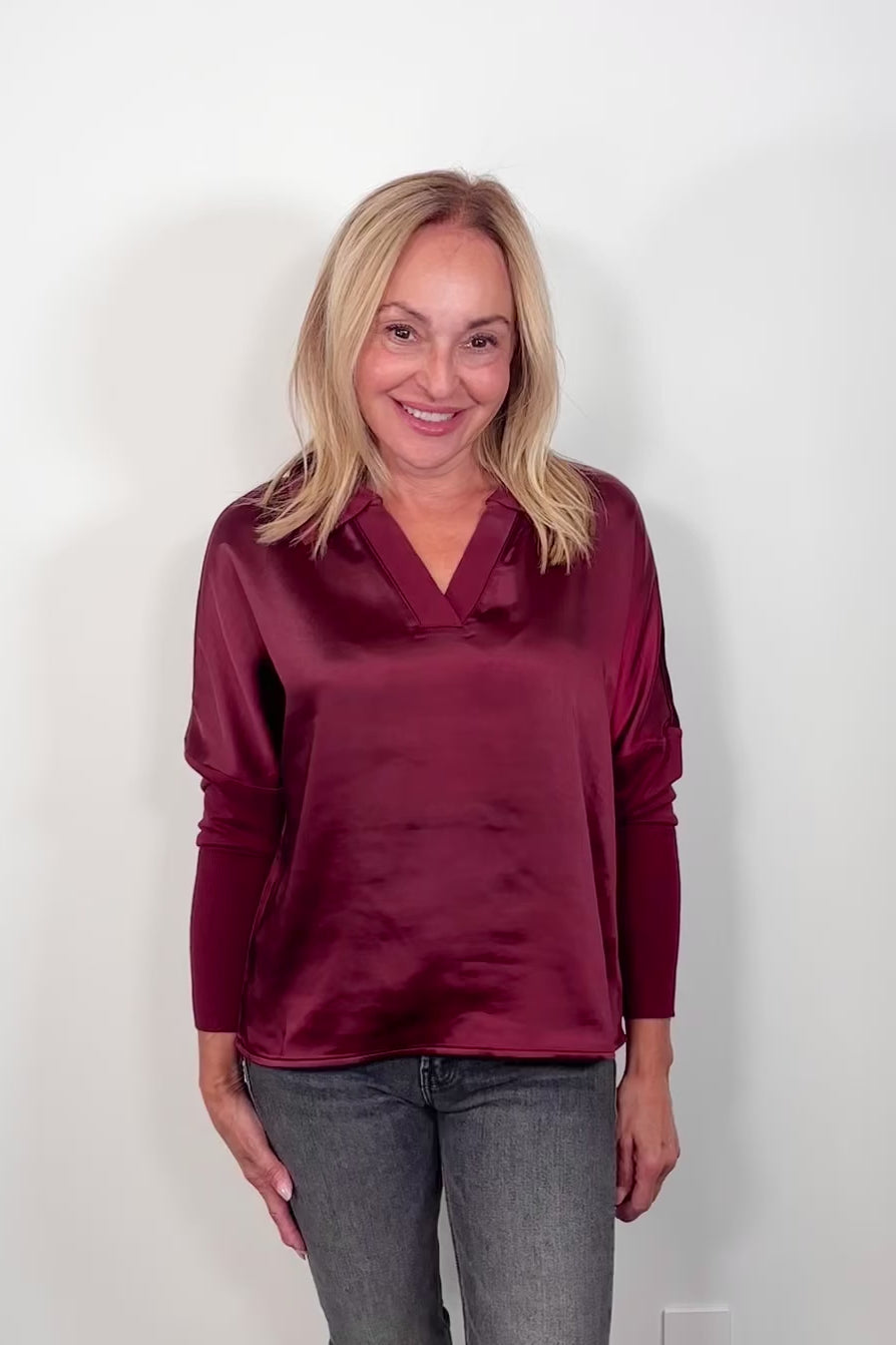 Video of a woman wearing a wine red mix satin lingerie sleeve top