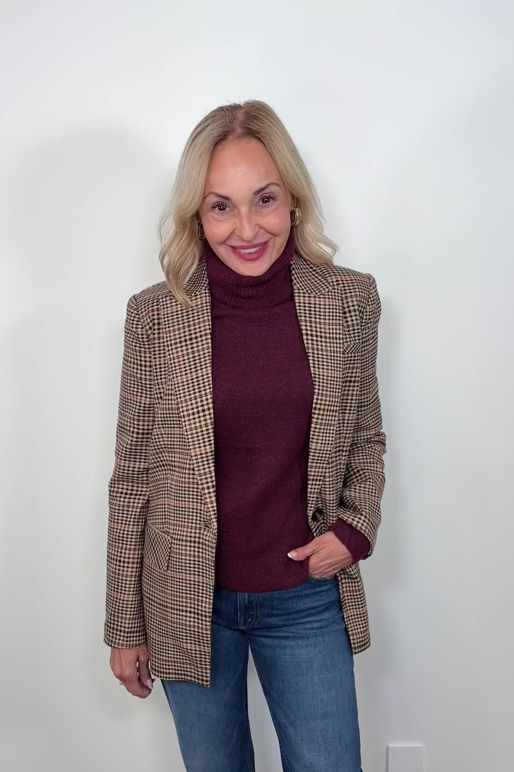 Video of a woman wearing a plaid blazer
