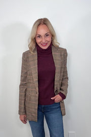 Video of a woman wearing a plaid blazer