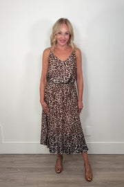 video of a woman wearing a gathered leopard print long skirt paired with a matching top