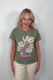 Video of a woman wearing a woodstok-festival printed tee